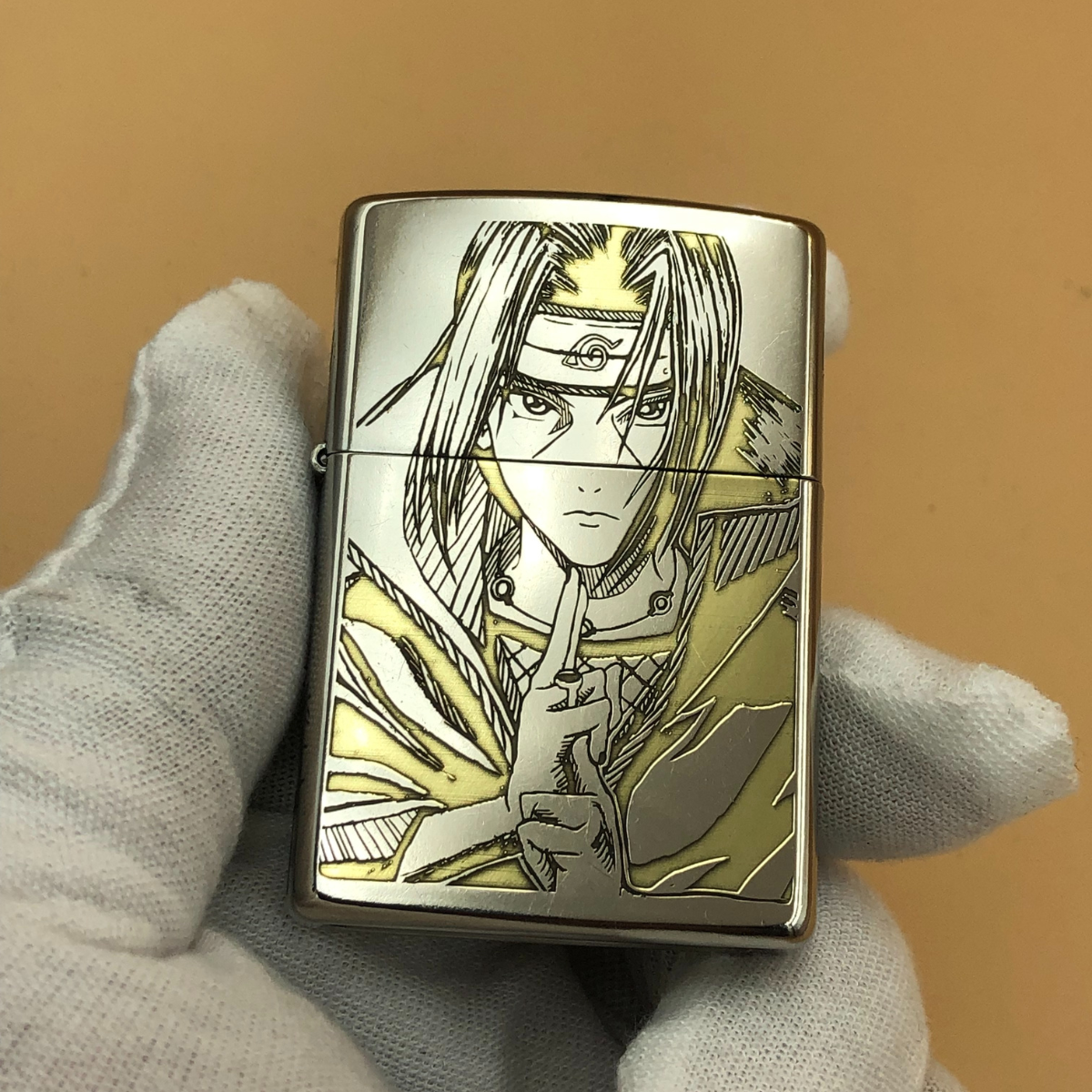 Lighter with anime character design held by a gloved hand against a beige background